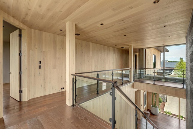 8005 Backwoods Dr, College Grove, TN 37046 - hallway featuring wood ceiling, an upstairs landing, wood finished floors, wooden walls, and a water view