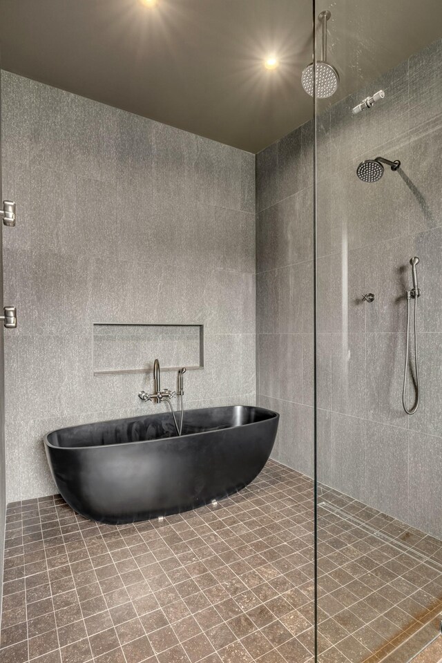 8005 Backwoods Dr, College Grove, TN 37046 - bathroom with a tile shower and a soaking tub