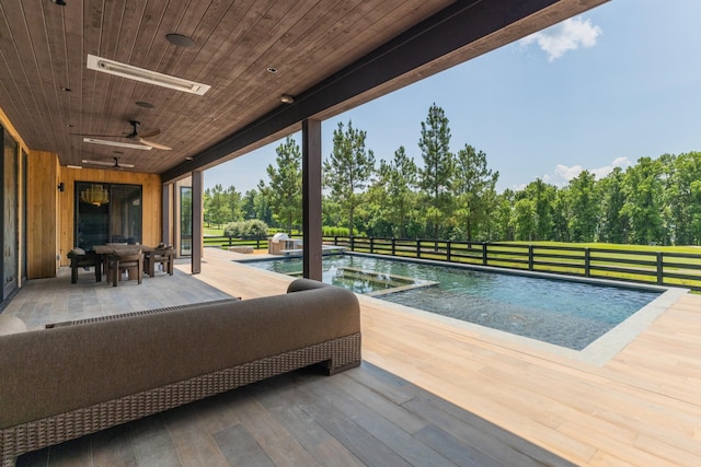 8005 Backwoods Dr, College Grove, TN 37046 - wooden terrace with ceiling fan, an outdoor pool, and view of scattered trees
