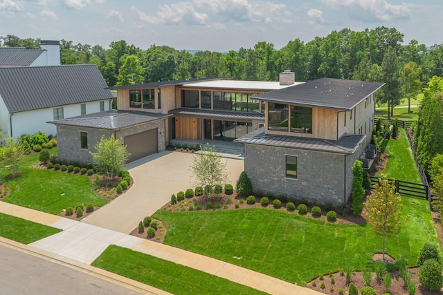 8005 Backwoods Dr, College Grove, TN 37046 - contemporary home featuring a chimney, driveway, a standing seam roof, a metal roof, and stone siding