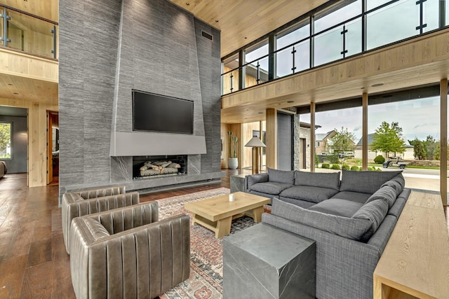 8005 Backwoods Dr, College Grove, TN 37046 - living room featuring a towering ceiling, hardwood / wood-style flooring, wood ceiling, and a fireplace