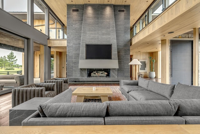 8005 Backwoods Dr, College Grove, TN 37046 - living room with a towering ceiling, wood finished floors, a large fireplace, and wooden ceiling
