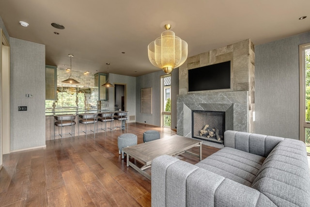 8005 Backwoods Dr, College Grove, TN 37046 - living room featuring wood finished floors, wallpapered walls, and a premium fireplace