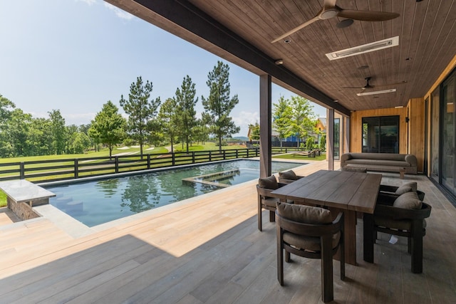 8005 Backwoods Dr, College Grove, TN 37046 - view of swimming pool featuring a ceiling fan, a pool with connected hot tub, and outdoor dining space