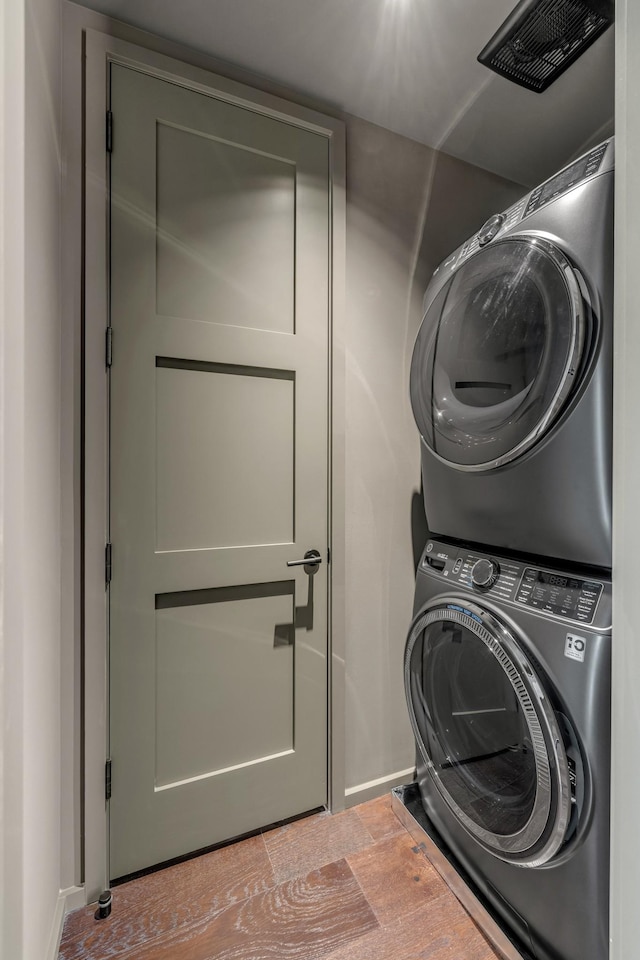 8005 Backwoods Dr, College Grove, TN 37046 - laundry area featuring stacked washer / drying machine and baseboards