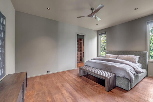 8005 Backwoods Dr, College Grove, TN 37046 - bedroom with light wood finished floors, ceiling fan, and recessed lighting