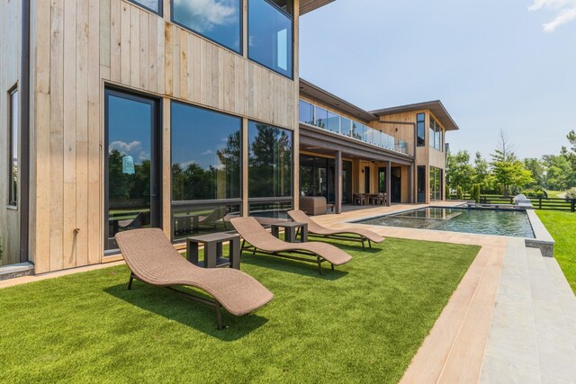 8005 Backwoods Dr, College Grove, TN 37046 - rear view of property featuring a yard, a balcony, and an outdoor pool