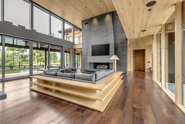 8005 Backwoods Dr, College Grove, TN 37046 - living area with wooden ceiling, a high ceiling, wood-type flooring, and a large fireplace