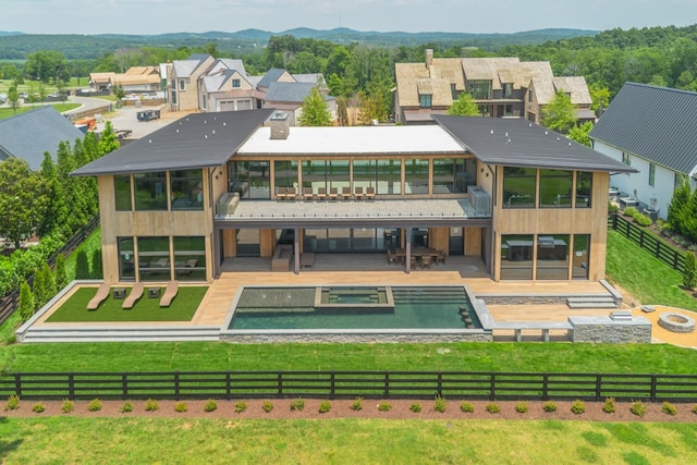 8005 Backwoods Dr, College Grove, TN 37046 - back of house featuring a sunroom, a patio, a pool with connected hot tub, and a residential view