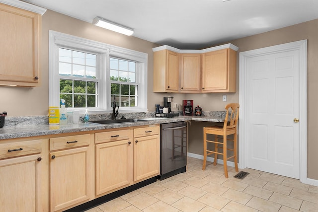3502 Kellys Ferry Rd, Chattanooga, TN 37419 - kitchen with light brown cabinetry, dishwashing machine, and light countertops