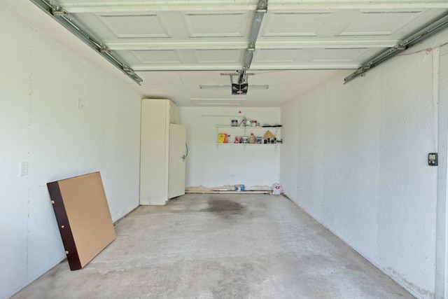 3502 Kellys Ferry Rd, Chattanooga, TN 37419 - garage featuring a garage door opener and freestanding refrigerator