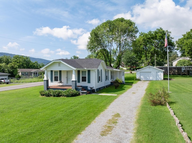 3502 Kellys Ferry Rd, Chattanooga, TN 37419 - view of front of home with covered porch, an outdoor structure, a front lawn, and a garage