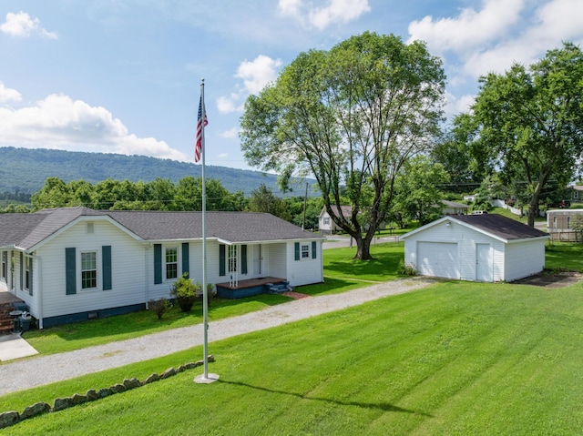 3502 Kellys Ferry Rd, Chattanooga, TN 37419 - view of front facade with an outbuilding, dirt driveway, a detached garage, a mountain view, and a front lawn