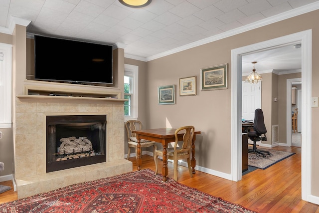 3502 Kellys Ferry Rd, Chattanooga, TN 37419 - living area with wood finished floors, a fireplace, crown molding, and an office area