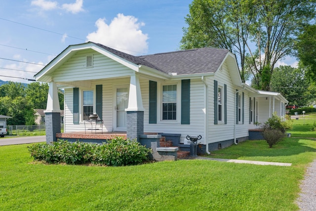 3502 Kellys Ferry Rd, Chattanooga, TN 37419 - view of front of home with a porch, a front yard, and roof with shingles