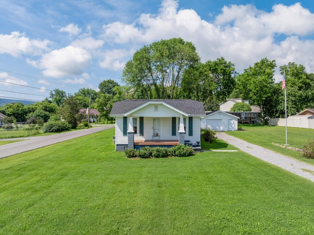 3502 Kellys Ferry Rd, Chattanooga, TN 37419 - bungalow-style home featuring a porch, driveway, an outbuilding, and a shingled roof