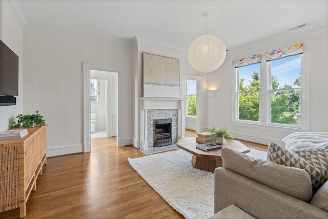 1504 Sweetbriar Ave, Nashville, TN 37212 - living room featuring ornamental molding, light wood finished floors, a fireplace, and a textured wall