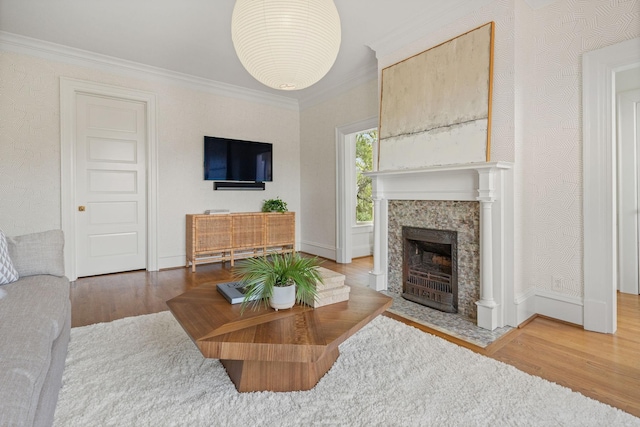 1504 Sweetbriar Ave, Nashville, TN 37212 - living area featuring wood finished floors, crown molding, and a fireplace
