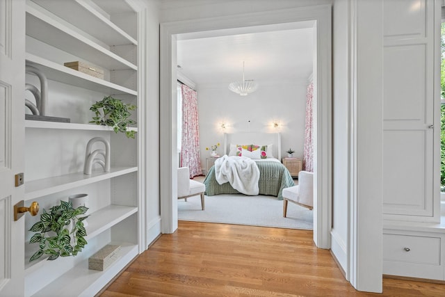 1504 Sweetbriar Ave, Nashville, TN 37212 - bedroom with wood finished floors, a chandelier, and ornamental molding