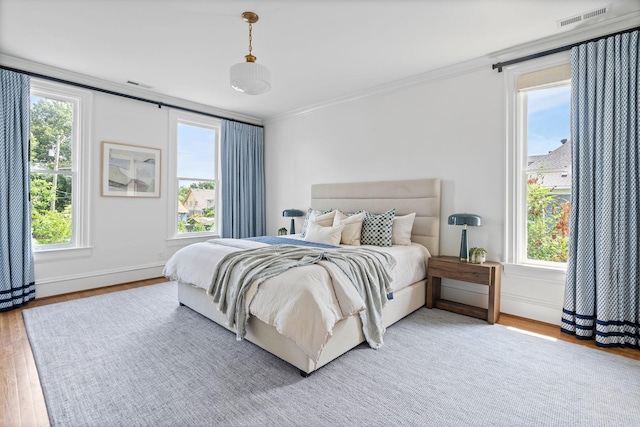 1504 Sweetbriar Ave, Nashville, TN 37212 - bedroom featuring light wood-style floors and ornamental molding