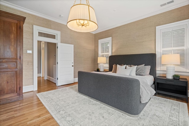 1504 Sweetbriar Ave, Nashville, TN 37212 - bedroom featuring light wood-style flooring, crown molding, and wallpapered walls
