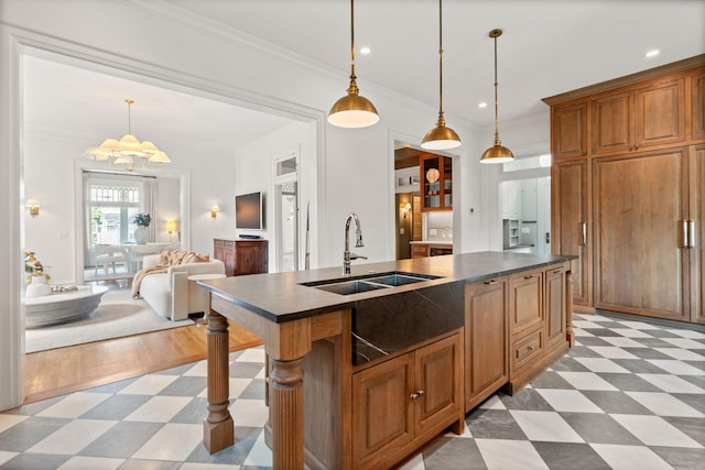 1504 Sweetbriar Ave, Nashville, TN 37212 - kitchen with light floors, dark countertops, brown cabinetry, a chandelier, and ornamental molding