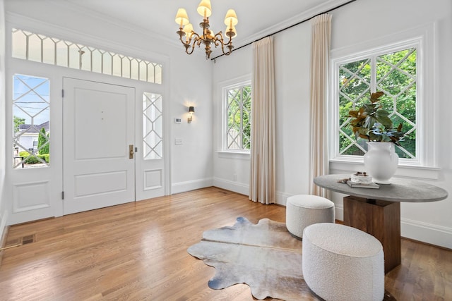 1504 Sweetbriar Ave, Nashville, TN 37212 - foyer with a chandelier, crown molding, and wood finished floors