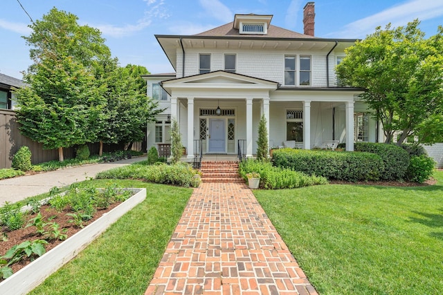 1504 Sweetbriar Ave, Nashville, TN 37212 - traditional style home featuring a front lawn, covered porch, and a chimney