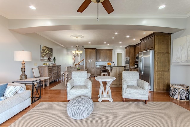 55B Oasis Ln, Savannah, TN 38372 - living area featuring light wood-style flooring, a ceiling fan, ornamental molding, a chandelier, and recessed lighting