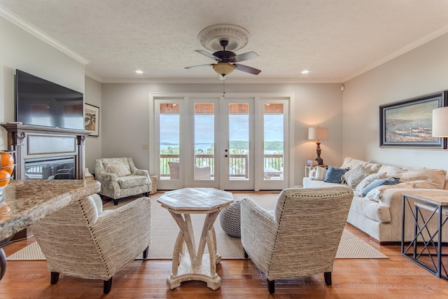 55B Oasis Ln, Savannah, TN 38372 - living area with ceiling fan, wood finished floors, french doors, recessed lighting, and crown molding