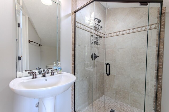 55B Oasis Ln, Savannah, TN 38372 - bathroom featuring a shower stall and a sink