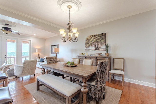 55B Oasis Ln, Savannah, TN 38372 - dining room with light wood-type flooring, ornamental molding, a chandelier, and a ceiling fan