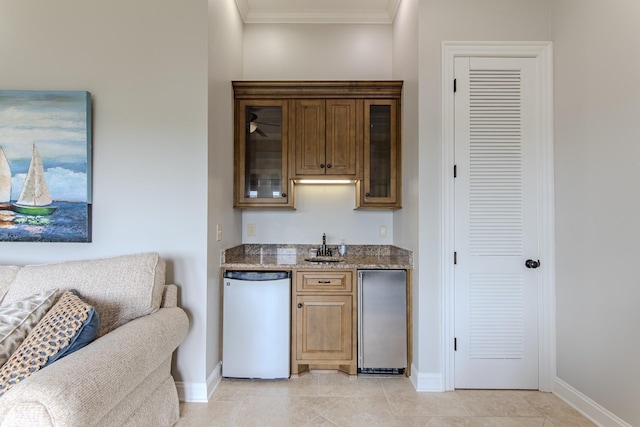 55B Oasis Ln, Savannah, TN 38372 - indoor wet bar with dishwasher, crown molding, refrigerator, and light tile patterned floors