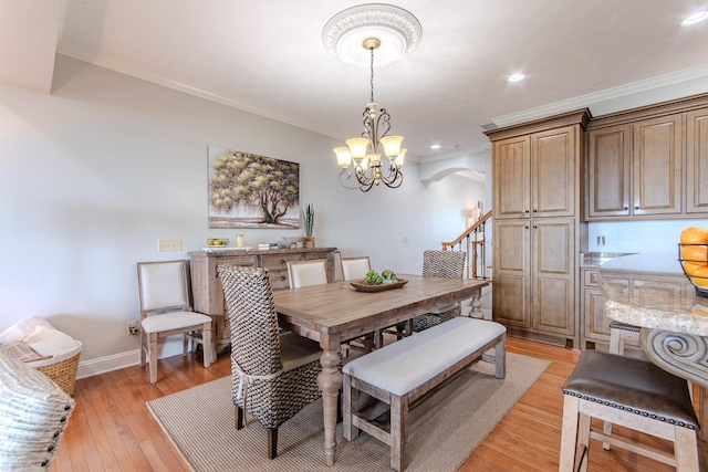 55B Oasis Ln, Savannah, TN 38372 - dining area featuring arched walkways, crown molding, light wood-style floors, a chandelier, and recessed lighting