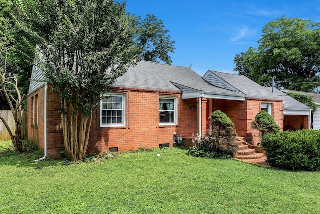 906 Grantland Ave, Murfreesboro, TN 37129 - view of front facade with brick siding, a front lawn, and a shingled roof