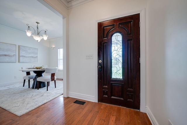 264 Firetower Rd, Dickson, TN 37055 - entrance foyer featuring ornamental molding, a chandelier, and wood-type flooring