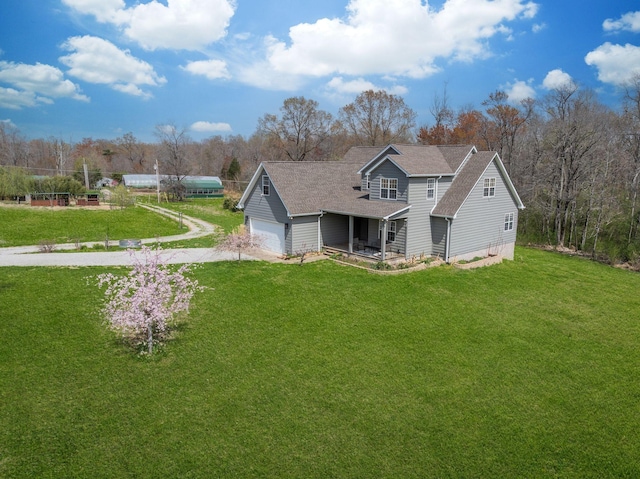 264 Firetower Rd, Dickson, TN 37055 - rear view of house featuring driveway, a garage, a lawn, and a shingled roof