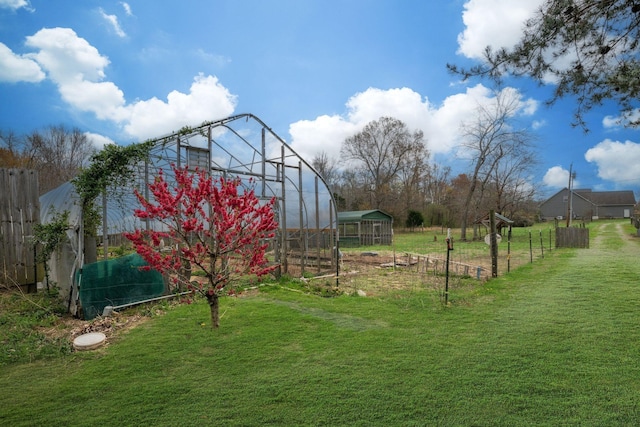 264 Firetower Rd, Dickson, TN 37055 - view of yard with a greenhouse and an outbuilding