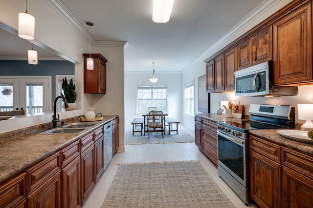 264 Firetower Rd, Dickson, TN 37055 - kitchen with appliances with stainless steel finishes, crown molding, hanging light fixtures, dark countertops, and french doors