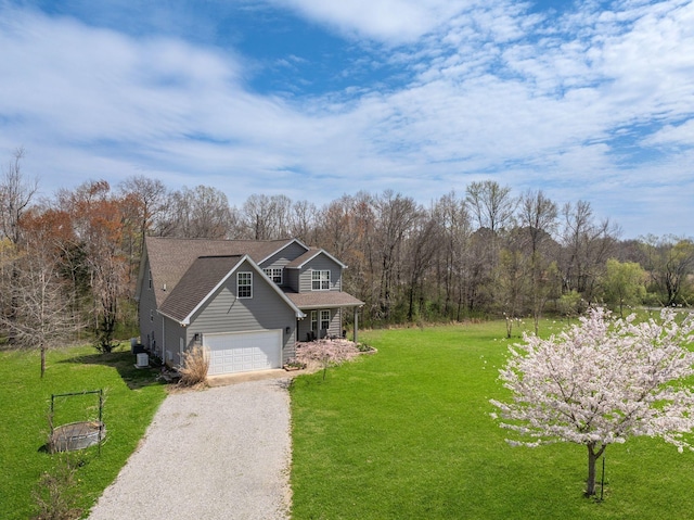 264 Firetower Rd, Dickson, TN 37055 - view of front of house featuring driveway, a front lawn, an attached garage, a shingled roof, and covered porch
