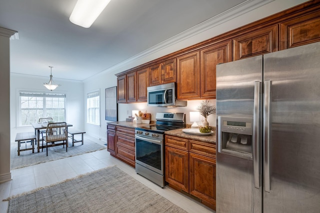 264 Firetower Rd, Dickson, TN 37055 - kitchen with appliances with stainless steel finishes, ornamental molding, brown cabinets, decorative light fixtures, and dark countertops