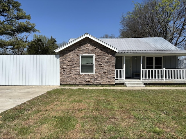 411 Hill St, Lebanon, TN 37087 - ranch-style home with stone siding, board and batten siding, a porch, a front lawn, and a metal roof