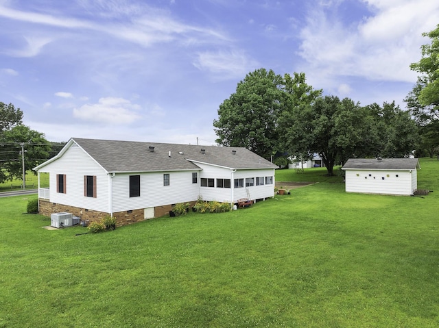 17930 Main St W, Huntingdon, TN 38344 - back of property with roof with shingles, a yard, crawl space, and a sunroom