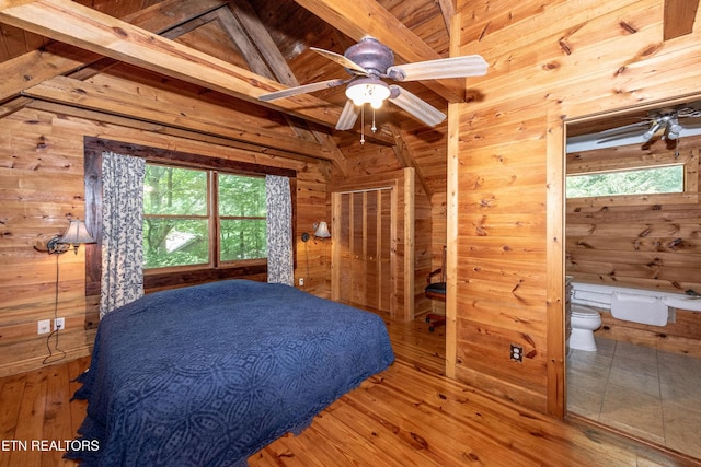 311 Domar Dr, Townsend, TN 37882 - bedroom featuring wooden walls, hardwood / wood-style floors, wooden ceiling, and connected bathroom