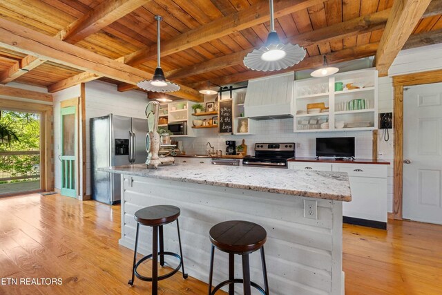 7539 W Old Highway 73, Townsend, TN 37882 - kitchen featuring appliances with stainless steel finishes, open shelves, a wooden ceiling with exposed beams, premium range hood, and light wood-style flooring