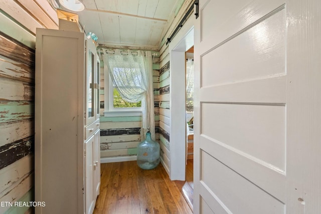 7539 W Old Highway 73, Townsend, TN 37882 - hall with wood-type flooring, wood ceiling, and a barn door