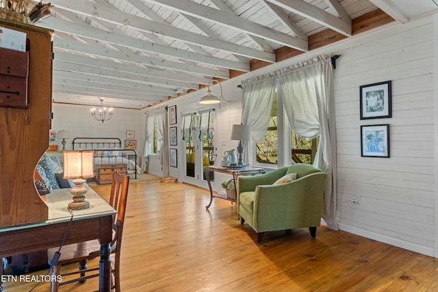 7539 W Old Highway 73, Townsend, TN 37882 - living room featuring wooden ceiling, a chandelier, wooden walls, and light wood-style flooring