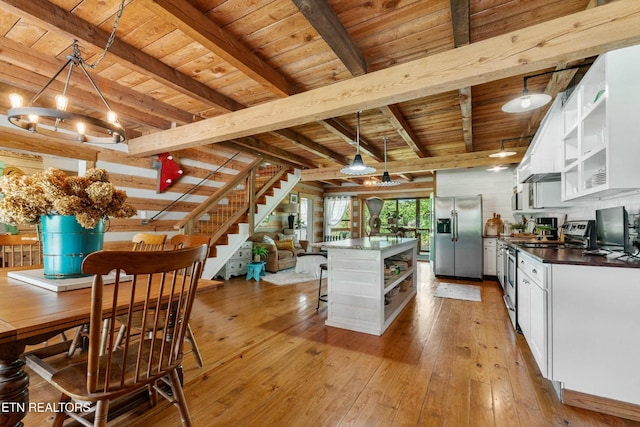 7539 W Old Highway 73, Townsend, TN 37882 - kitchen with open shelves, appliances with stainless steel finishes, a wooden ceiling with exposed beams, dark countertops, and white cabinetry