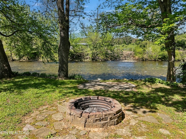 7539 W Old Highway 73, Townsend, TN 37882 - view of green lawn with an outdoor fire pit and a water view