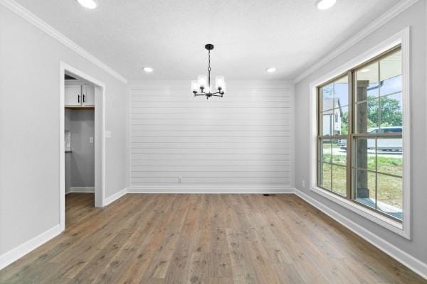 122 Monaghan Dr, Clarksville, TN 37042 - unfurnished dining area featuring ornamental molding, a chandelier, wood finished floors, and recessed lighting